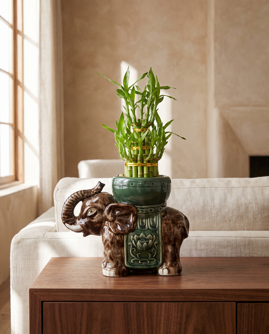 Trunk-up Tower elephant on a walnut living-room console, ceramic included