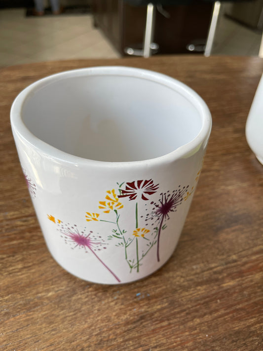 White ceramic cup pot with yellow, burgundy, and purple pressed wildflower print